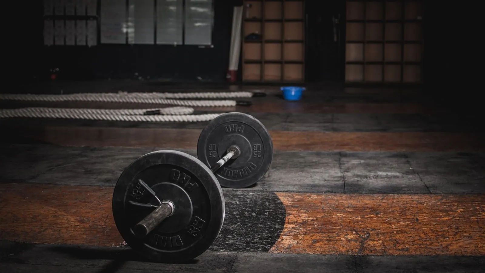 Loaded barbell resting on a gym floor