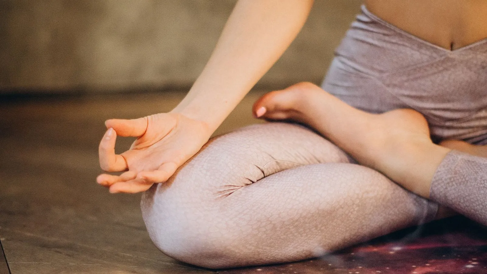 Person sitting cross-legged in a meditation pose